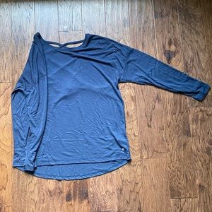Blue long sleeve shirt with detailing on back